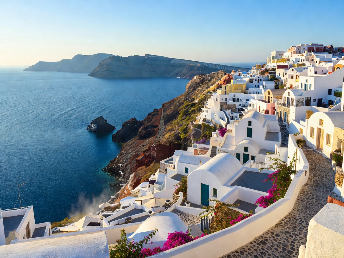 Santorini whitewashed buildings overlooking deep blue Aegean Sea