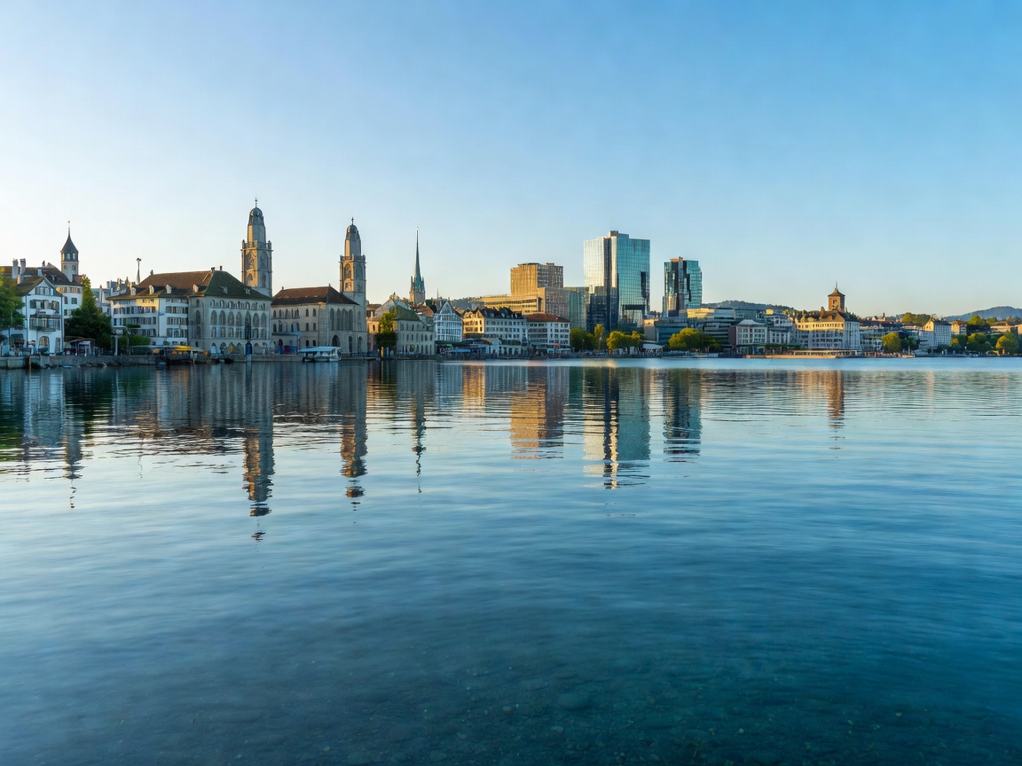 Zurich city skyline alongside pristine lake water and Alpine mountain backdrop